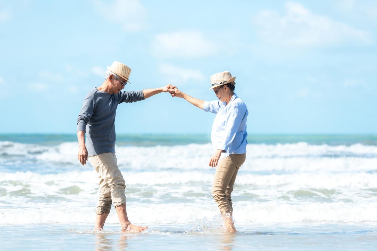 aisan couple shag dancing on the beach