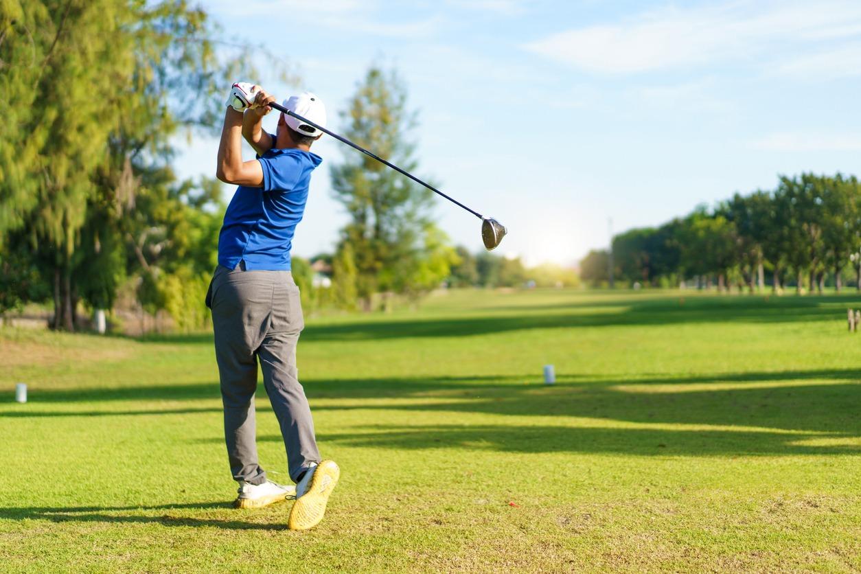 Asian man is playing golf in morning on Father's Day.